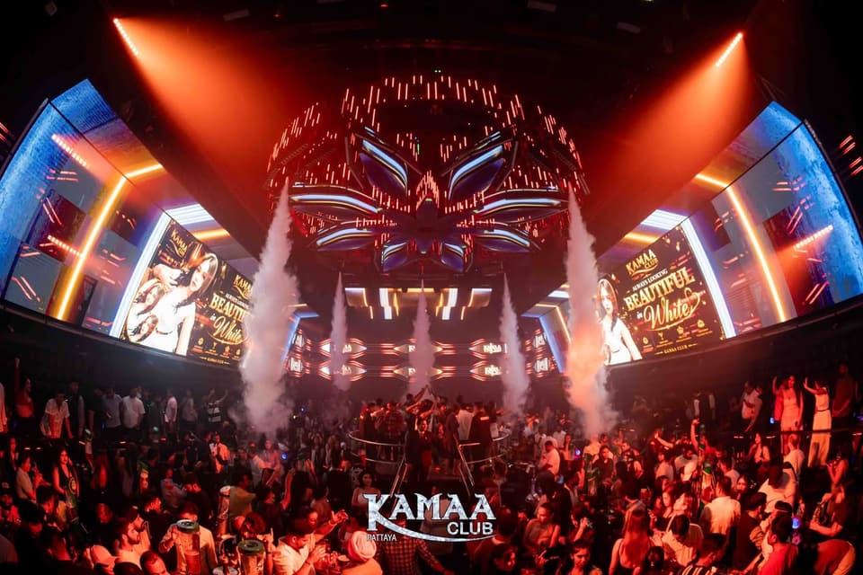 Packed main room with CO2 jets and red stage lights at Kamaa Club Pattaya