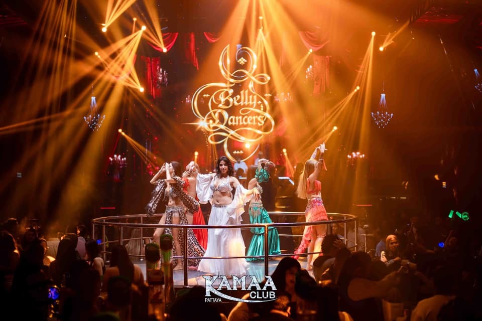 Belly dance show on stage under golden light at Kamaa Club Pattaya