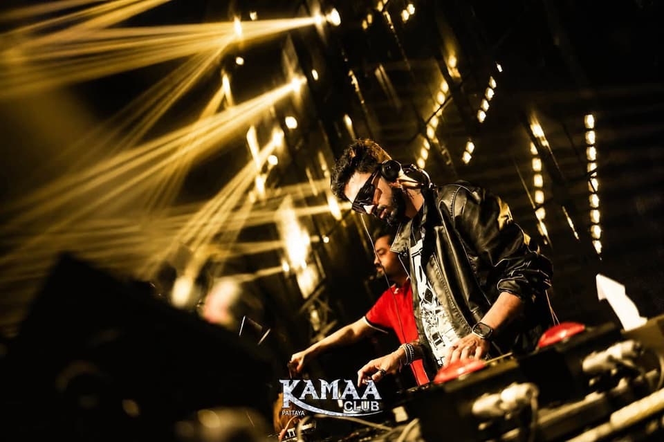 DJ performing under golden lights at Kamaa Club Pattaya