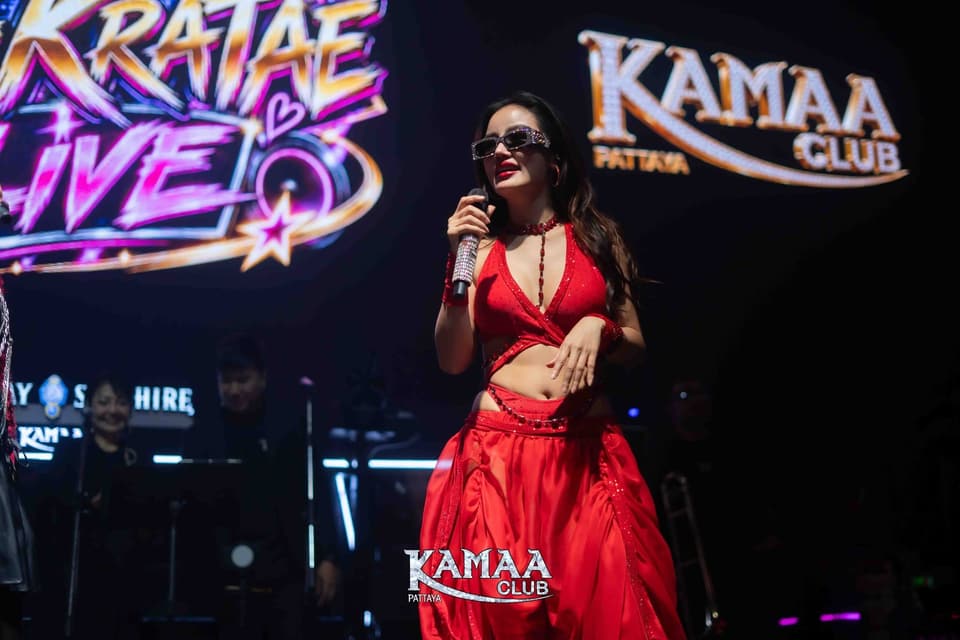Singer in red performing at a 'Kratae Live' night at Kamaa Club Pattaya