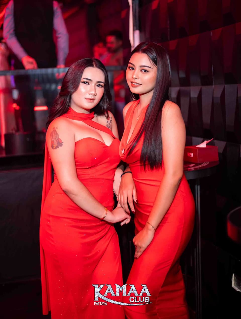Two friends in matching red dresses at Kamaa Club Pattaya