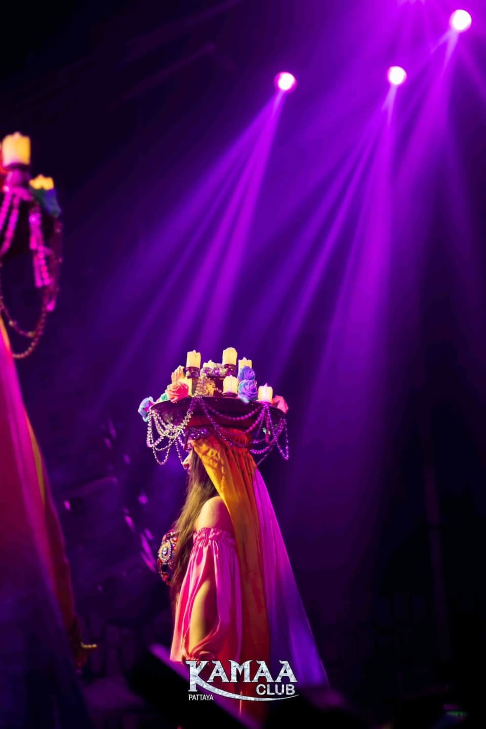 Performer in a crowned costume under purple spotlights at Kamaa Club Pattaya