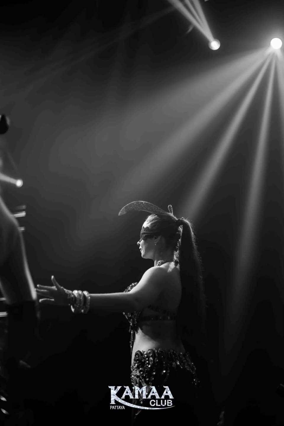 Black-and-white photo of a dancer on stage at Kamaa Club Pattaya