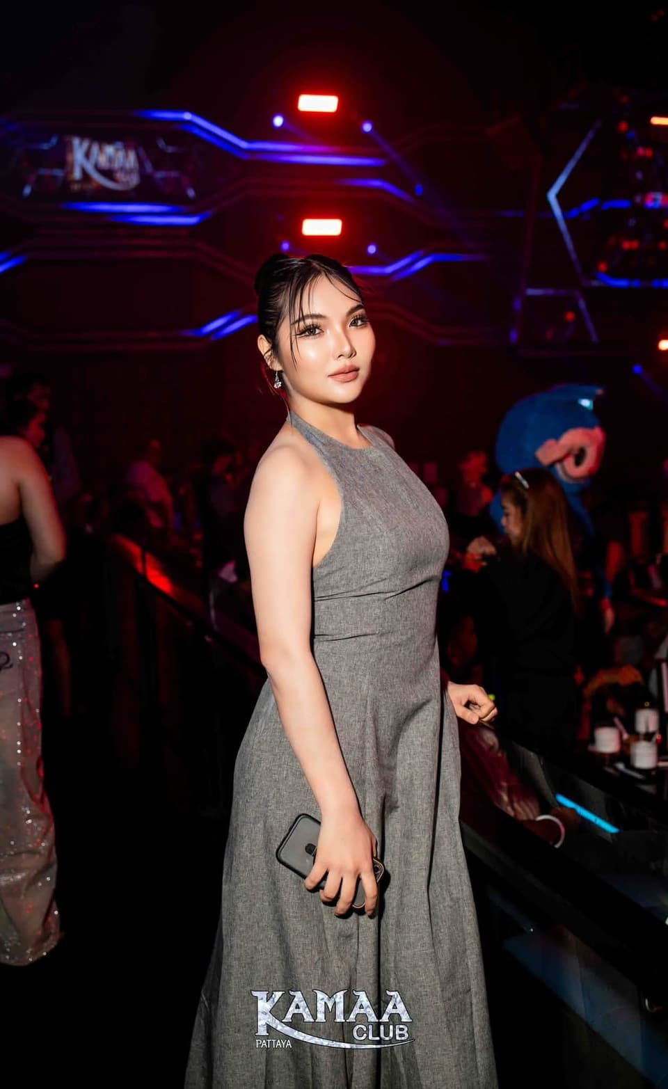 Guest in a grey dress under club lights at Kamaa Club Pattaya