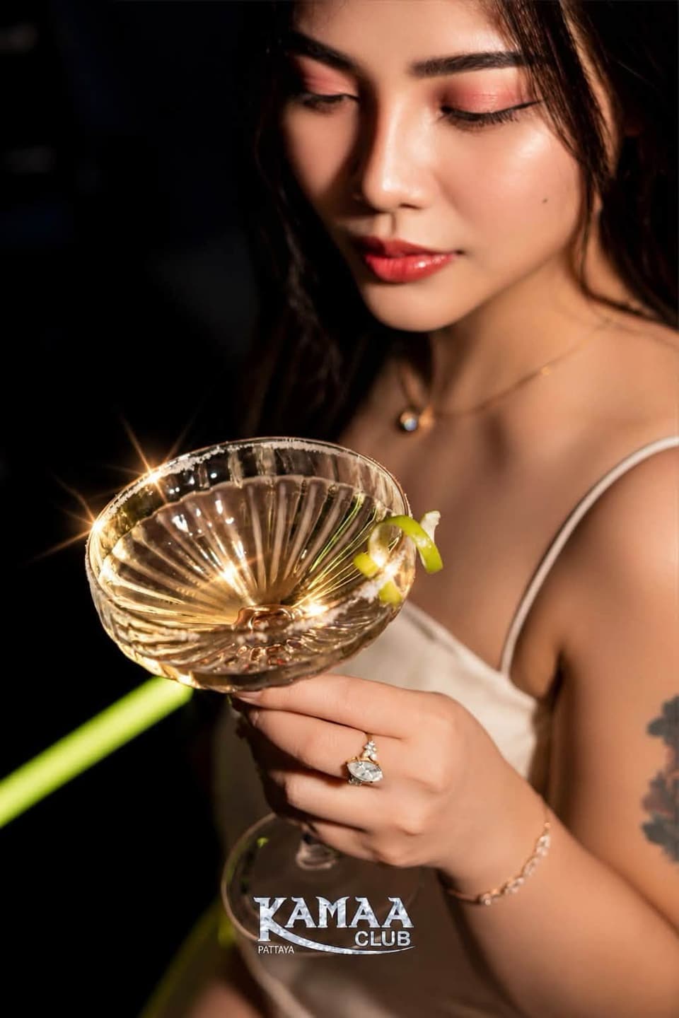 Guest holding a champagne coupe at Kamaa Club Pattaya